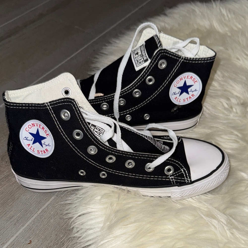 Converse women’s Black and White High-Top Sneakers